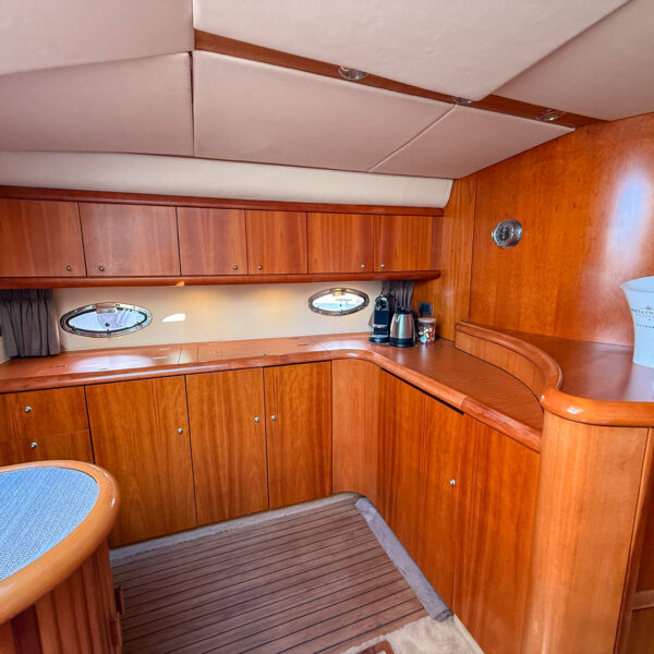 Interior salon of Sunseeker 50 yacht Pylos with kitchen in Mallorca
